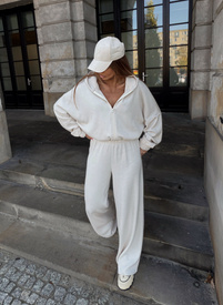 A light beige, solid-color women's set with wool