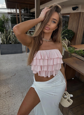 Pink off-the-shoulder blouse with ruffles